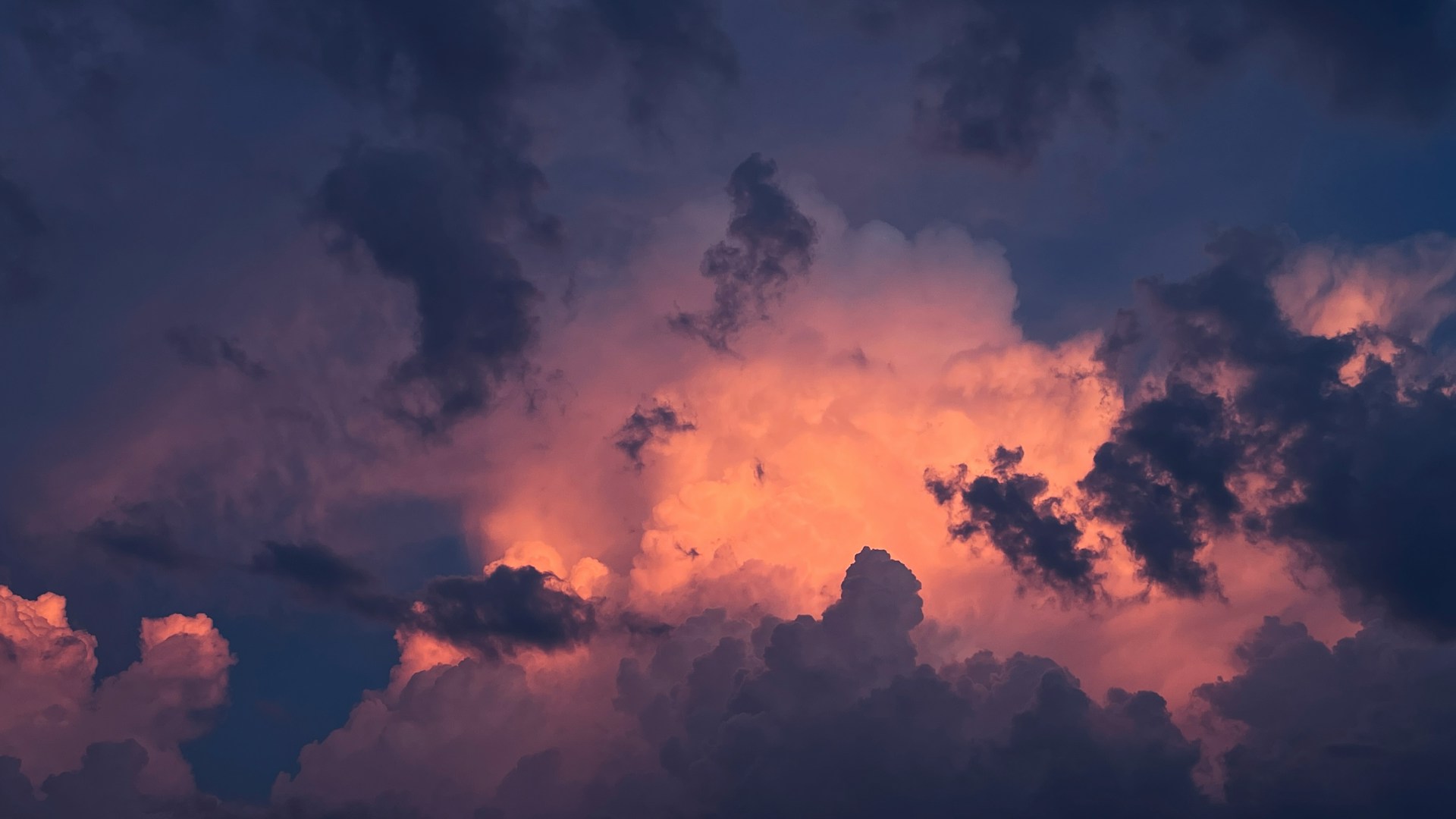 Decorative cloud graphic with bright open sky.